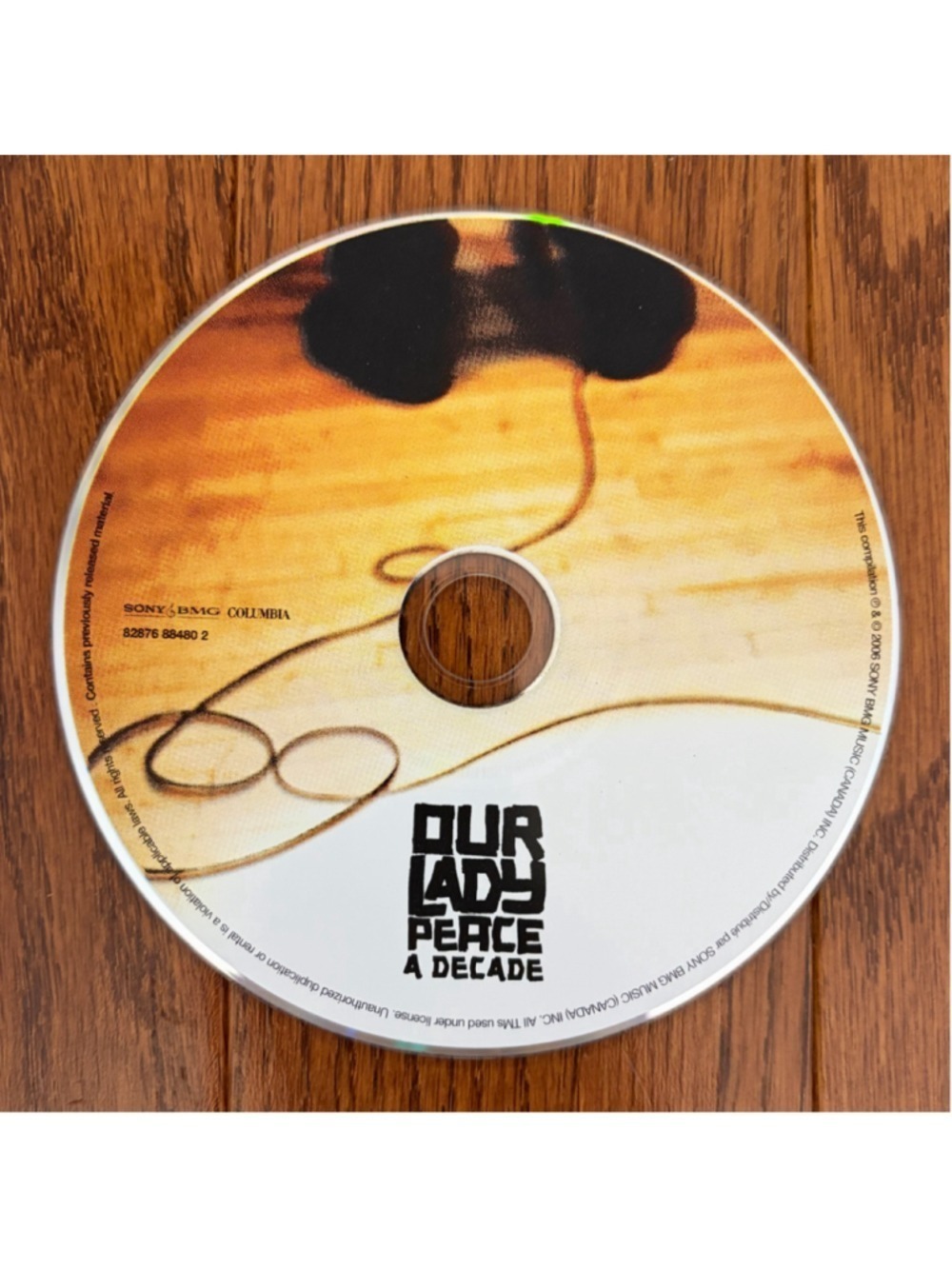 Our Lady Peace A Decade CD Album Orange and Black One Size